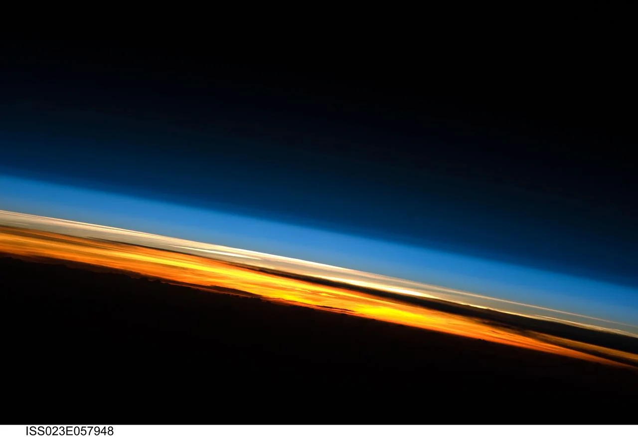 Sunset along Earth's atmosphere, photographed from the International Space Station